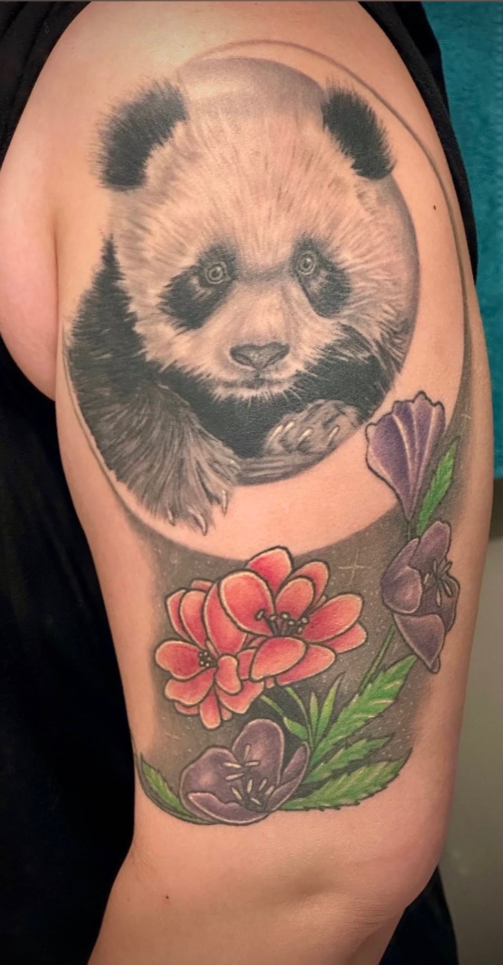 Realistic panda with florals half sleeve